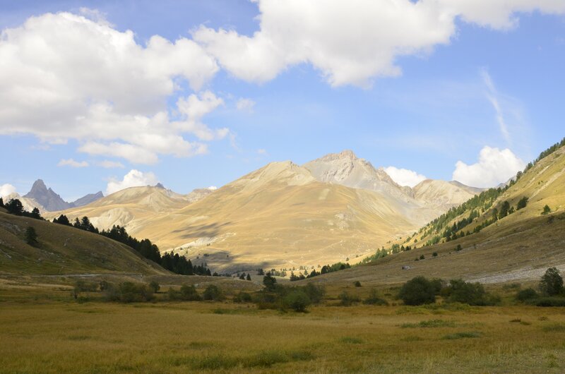 Mountain valley under cloudy sky