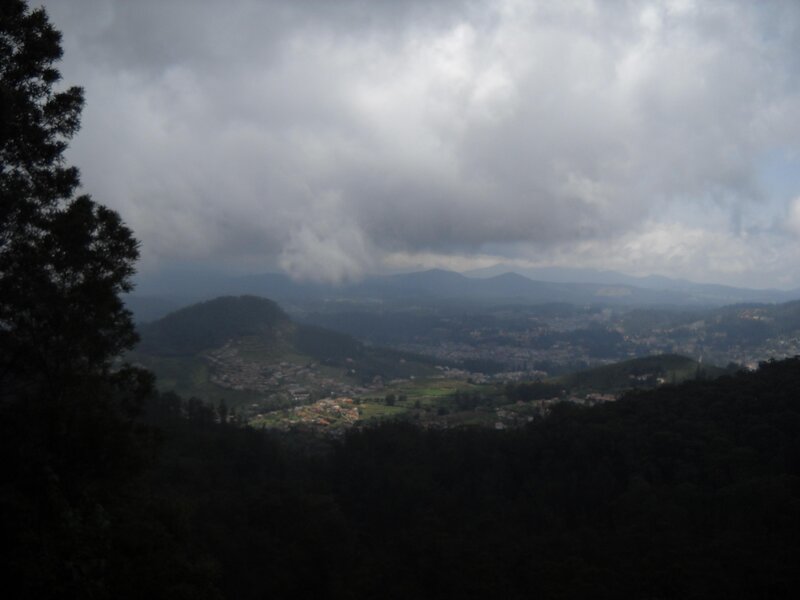Mountain valley under cloudy sky