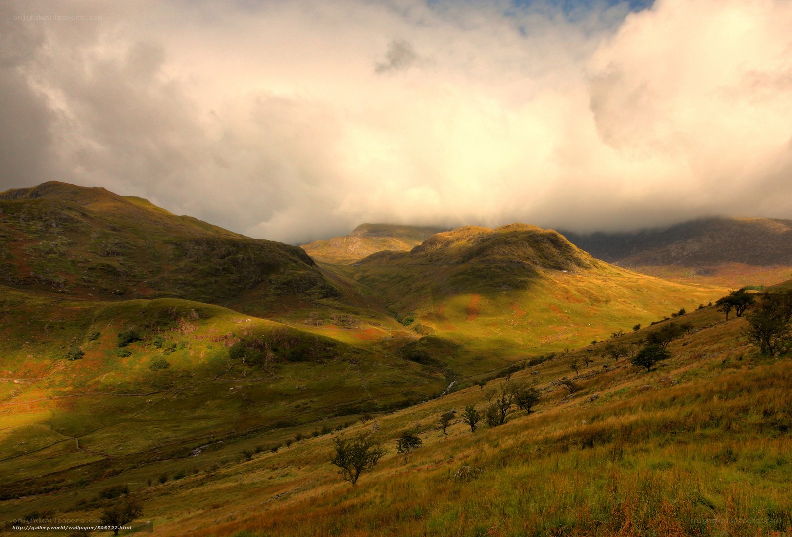 Mountain valley under cloudy sky