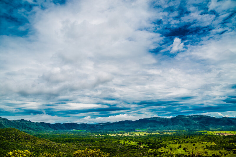 Mountain valley under cloudy sky