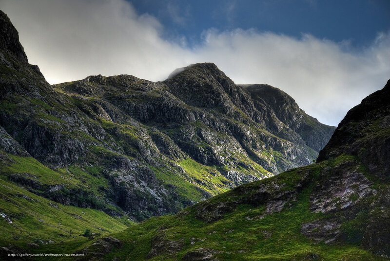 Mountain valley under cloudy sky