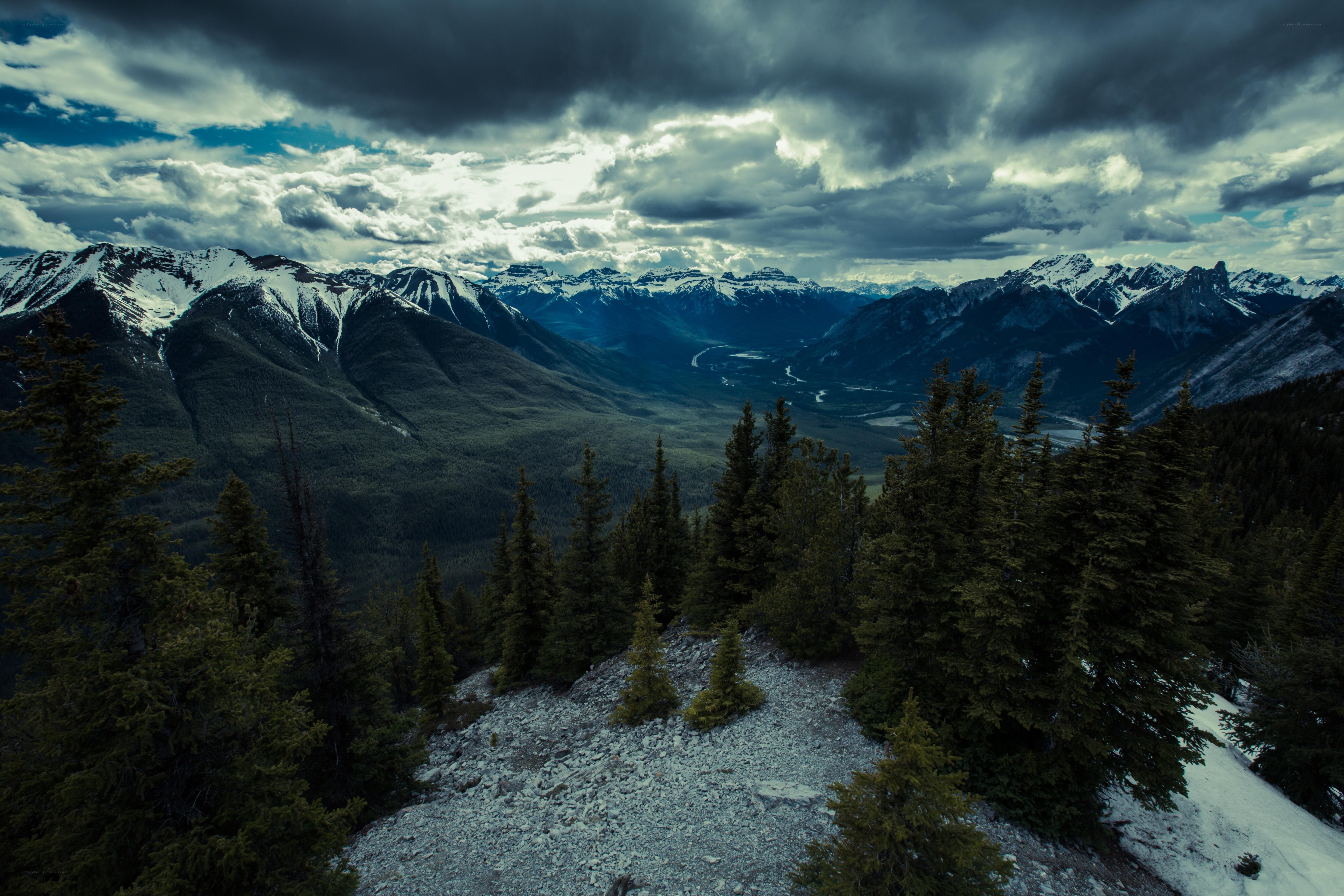 Mountain valley under stormy sky