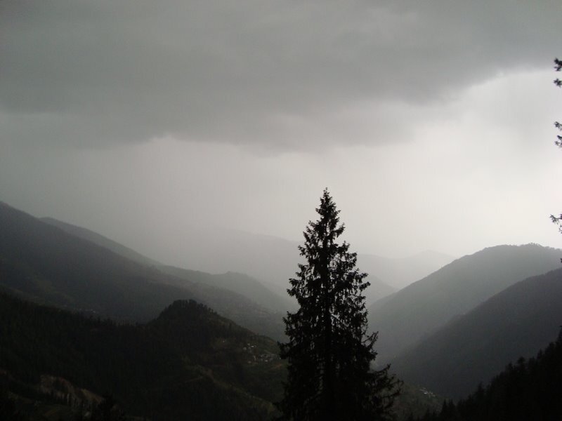 Mountain valley under stormy sky
