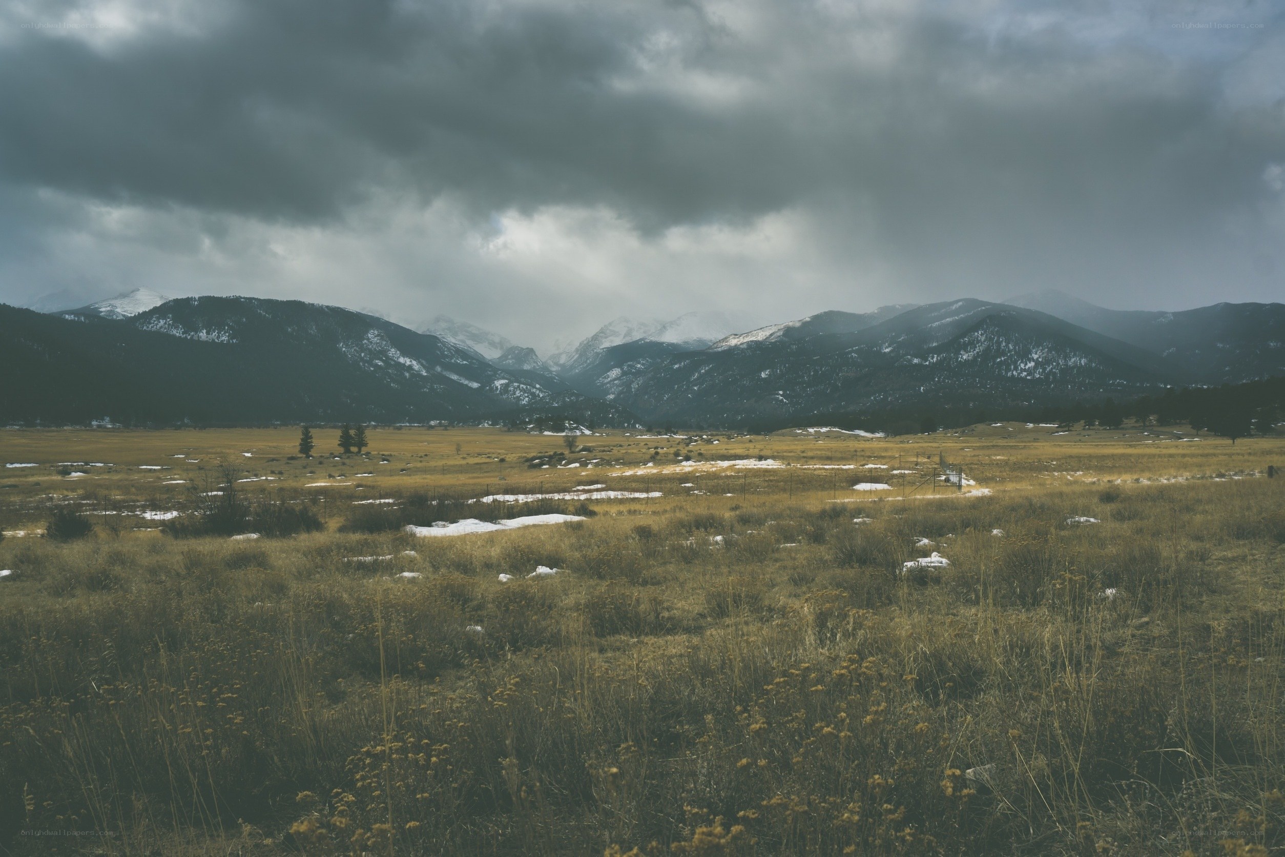 Mountain valley under stormy sky