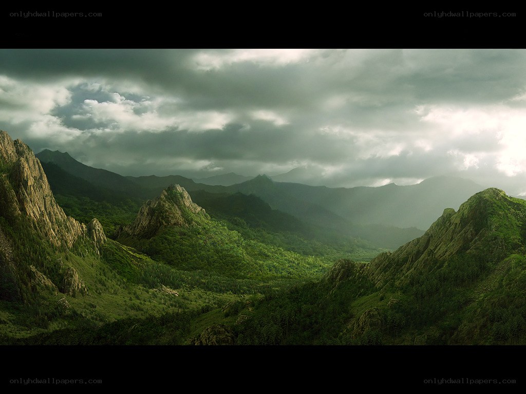 Mountain valley under stormy sky
