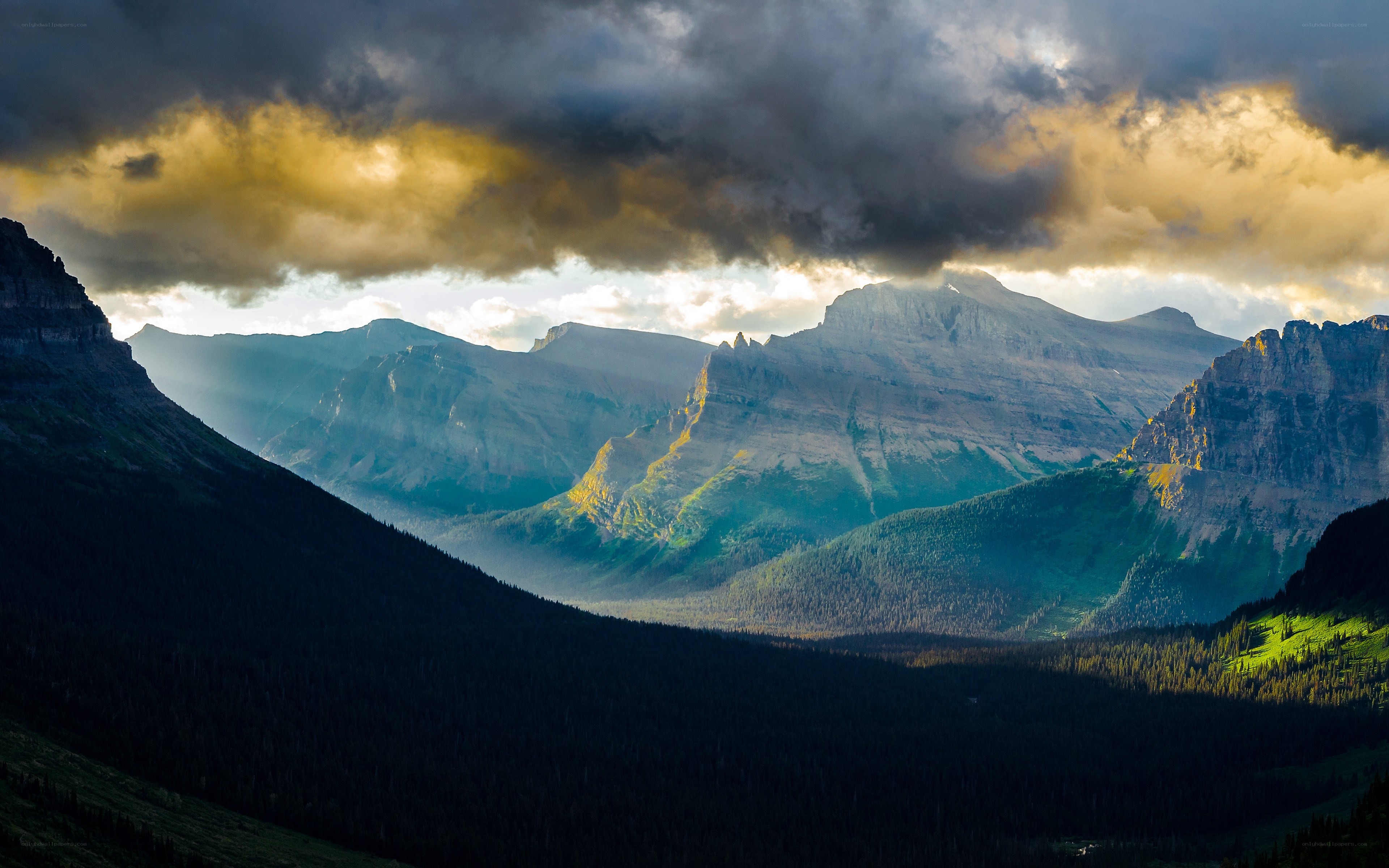 Mountain valley under stormy sky