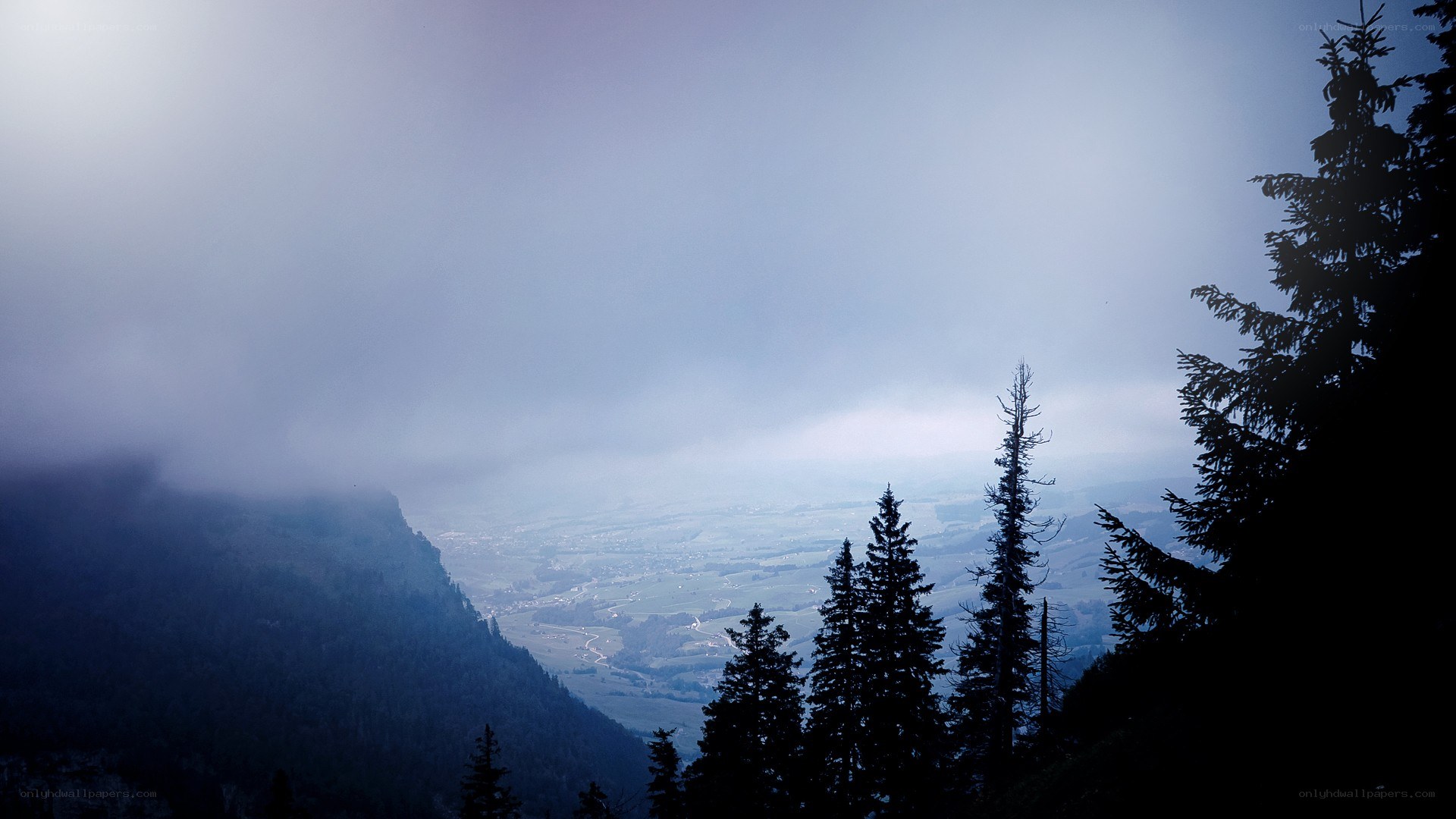 Mountain valley view through fog