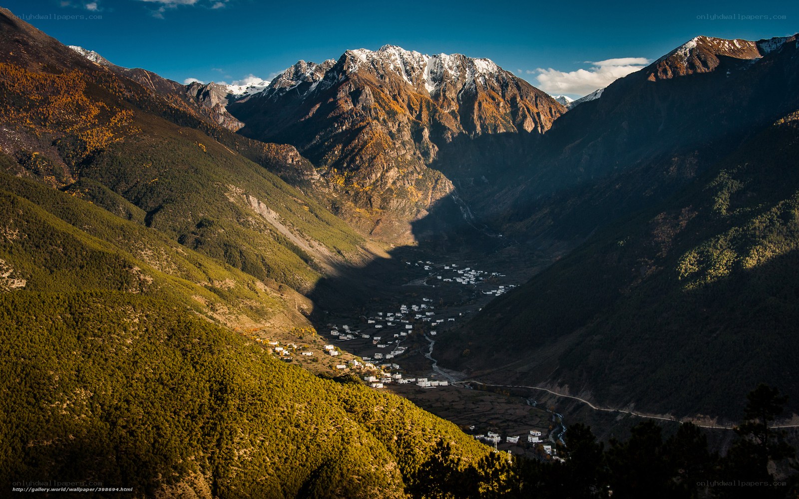 Mountain valley village at sunset