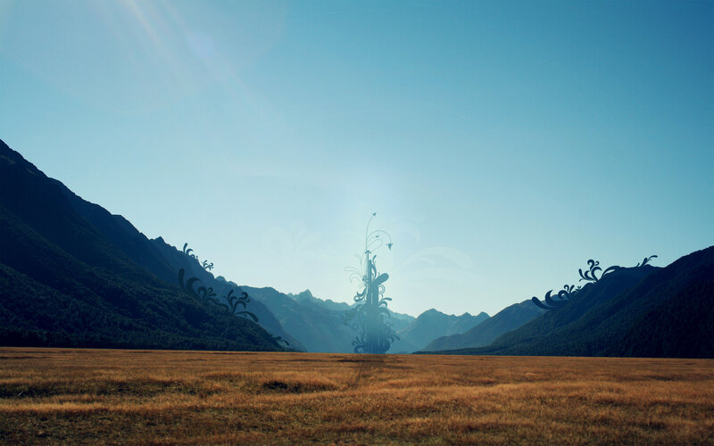 Mountain valley with abstract sculpture