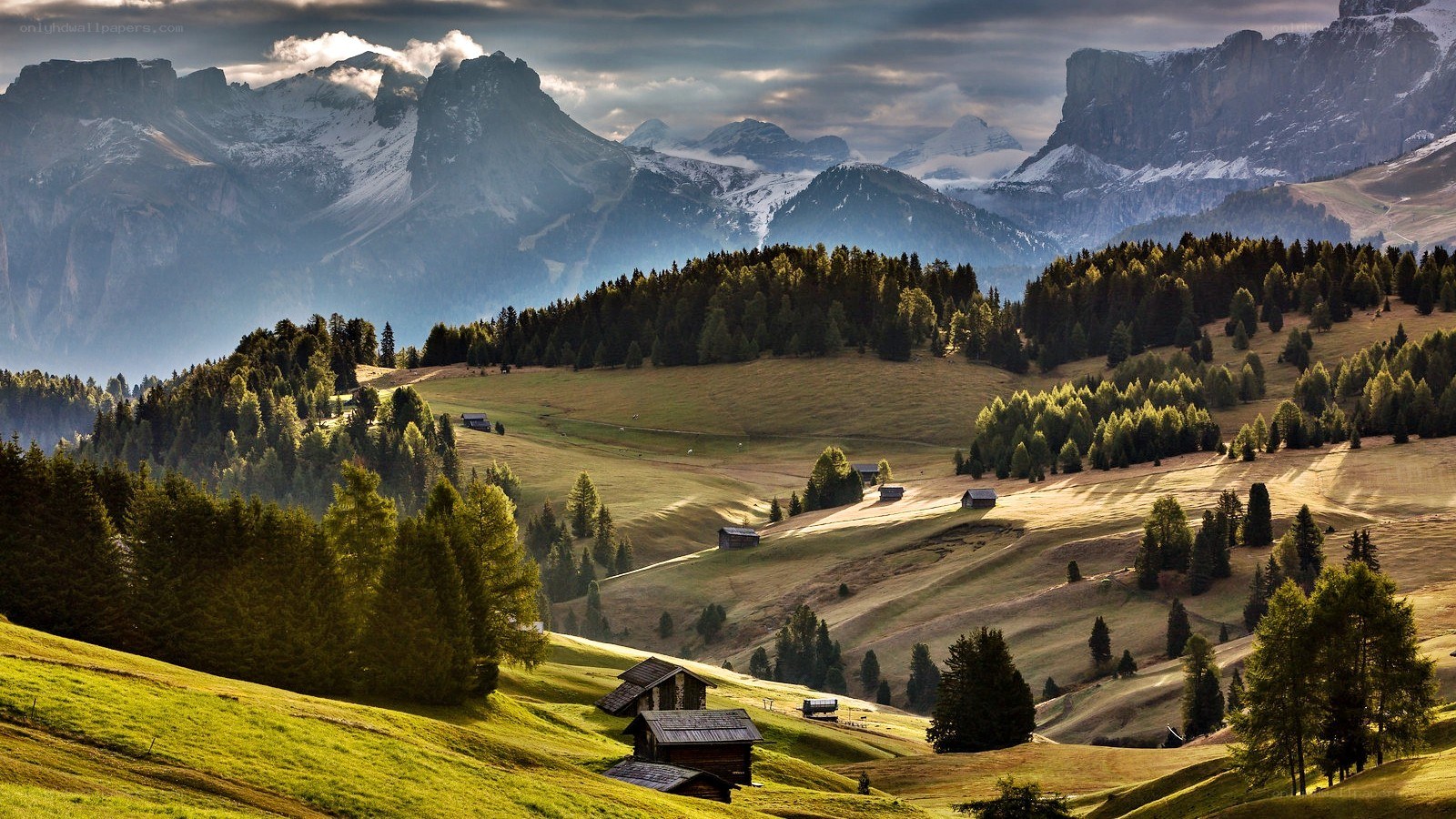 Mountain valley with alpine huts
