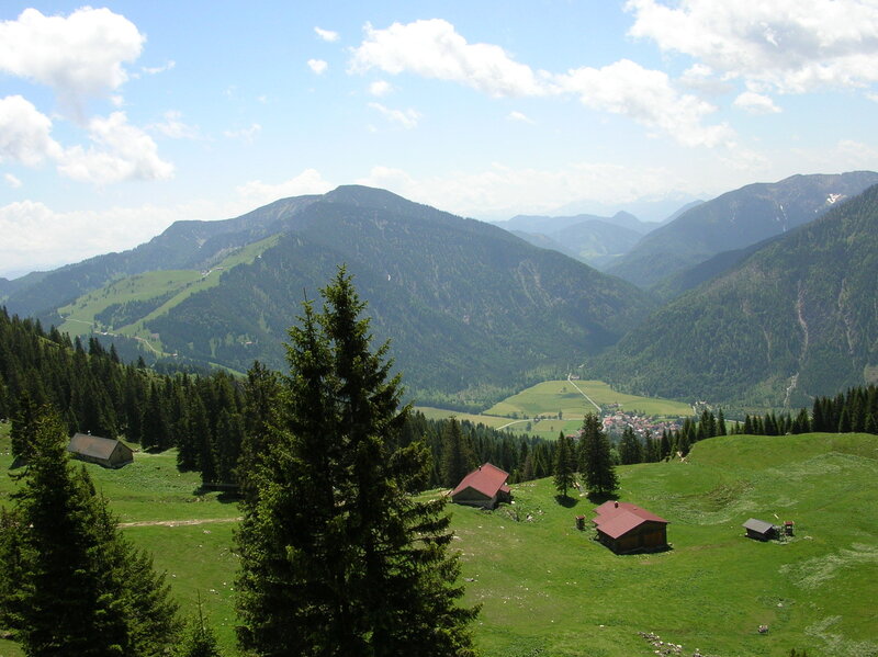 mountain valley with alpine huts