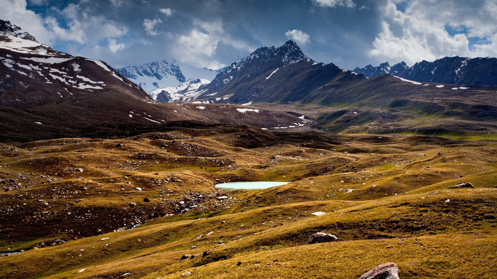 Mountain valley with alpine lake