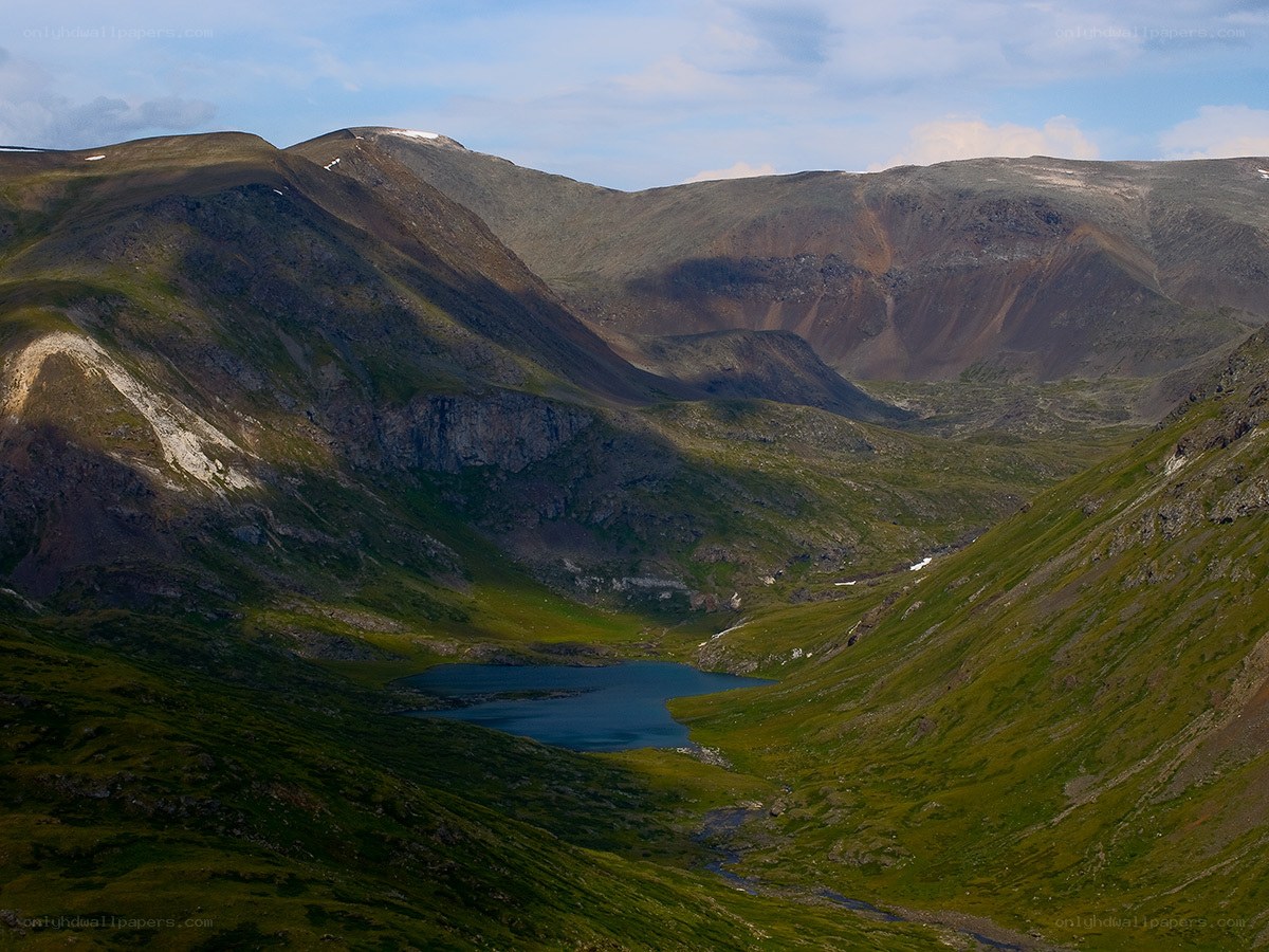 Mountain valley with alpine lake
