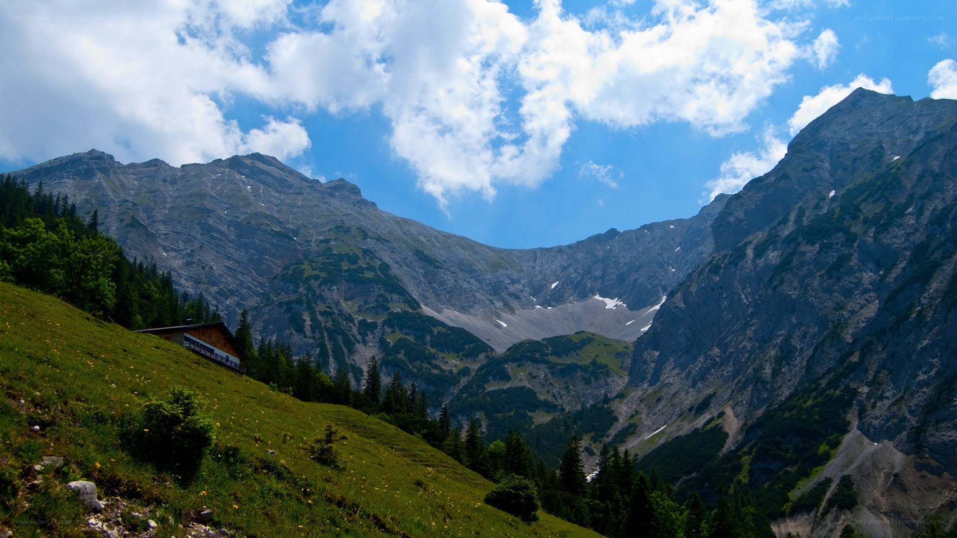 Mountain valley with cabin