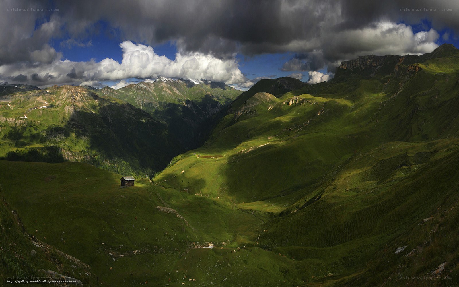 Mountain valley with cabin