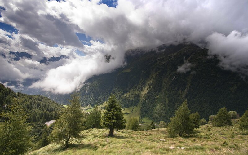 Mountain valley with clouds