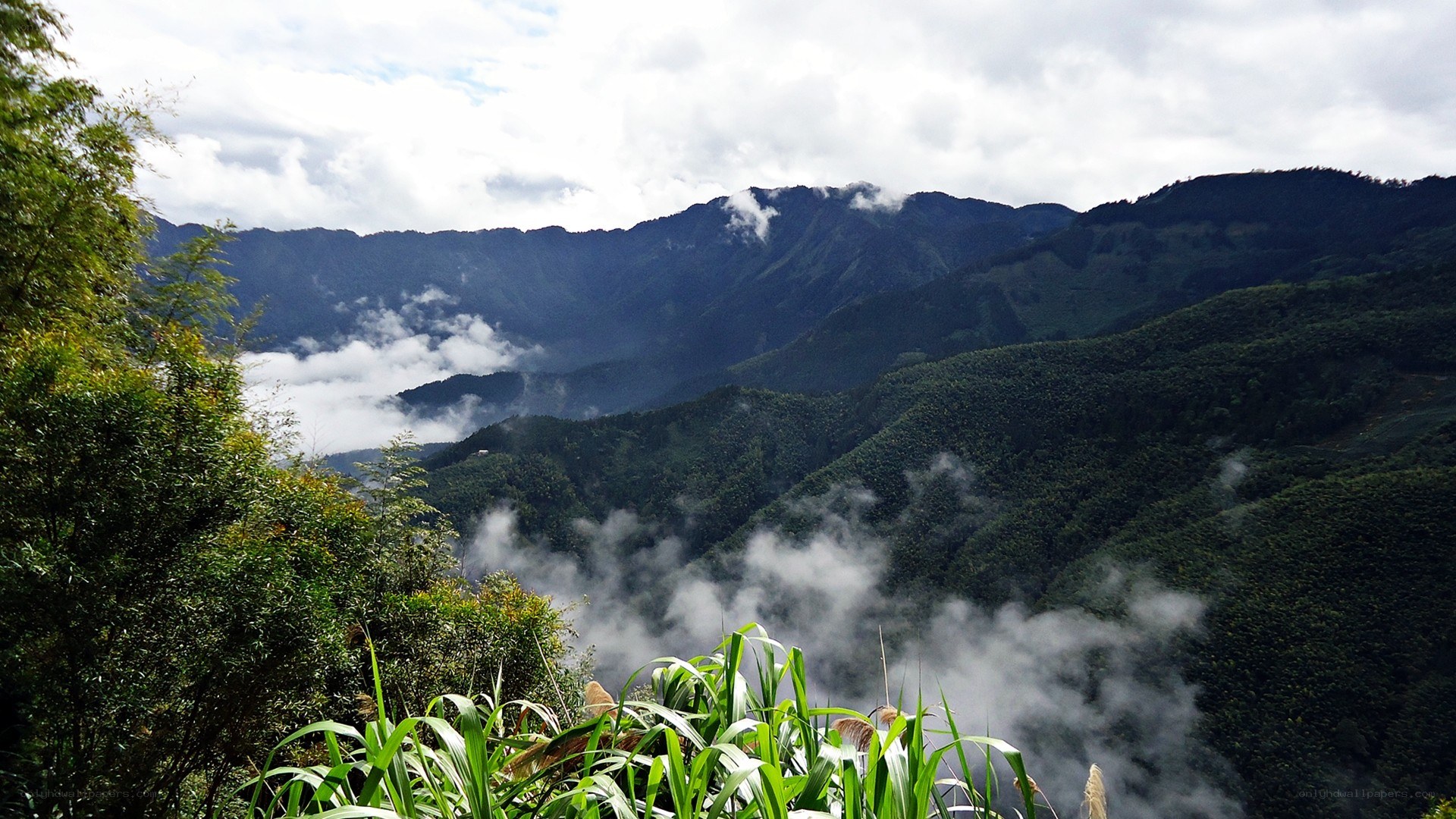 Mountain valley with clouds