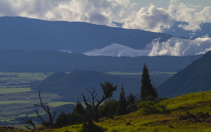 Mountain valley with clouds