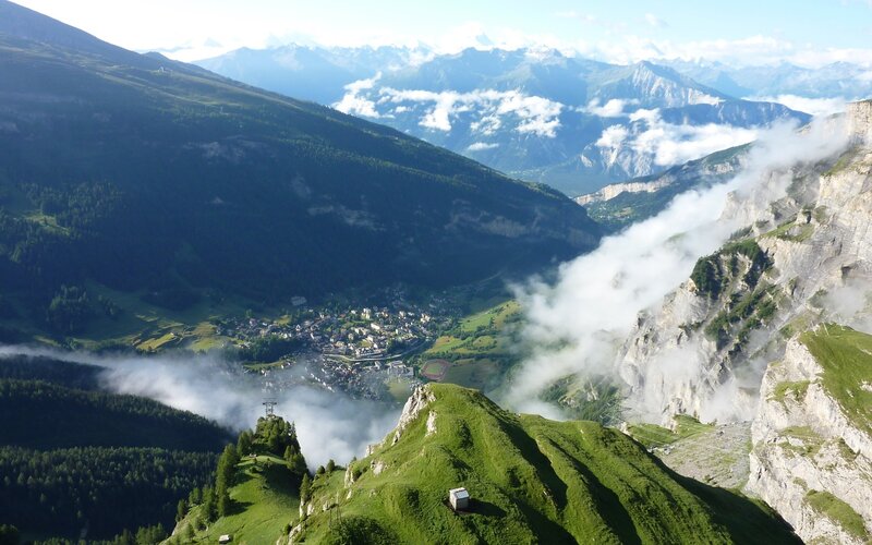Mountain valley with clouds