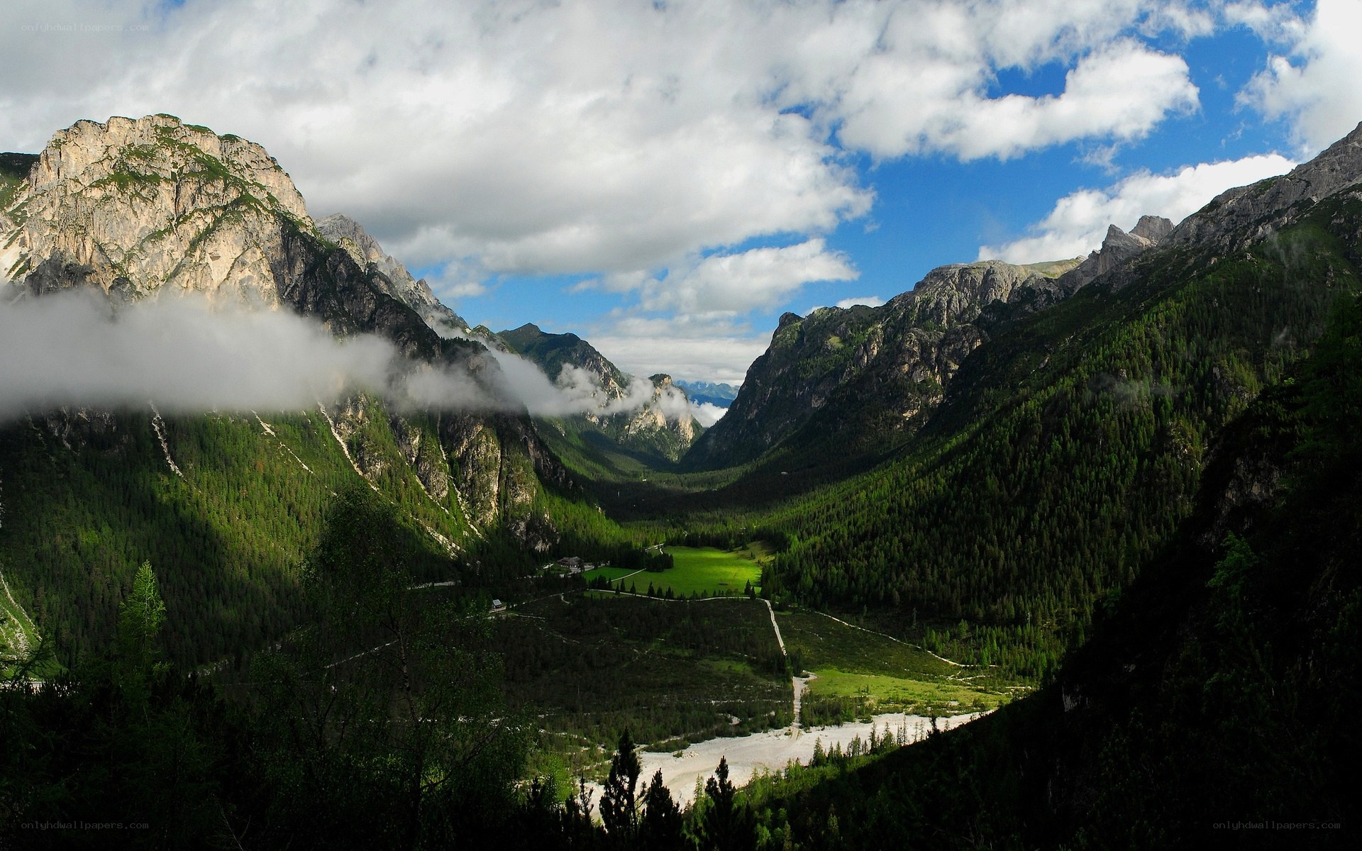 Mountain valley with clouds