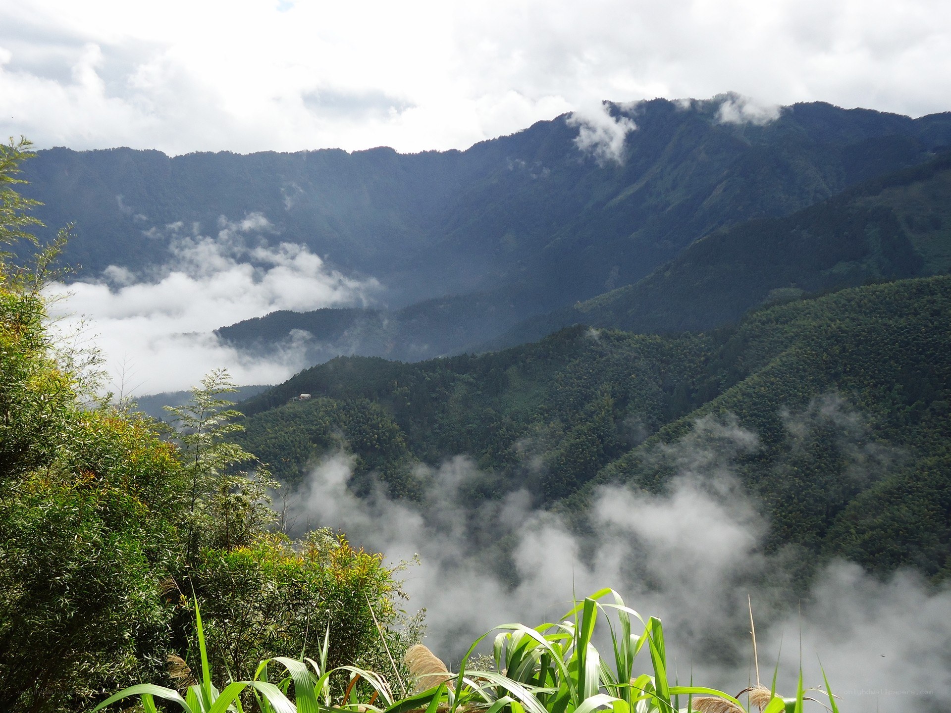 Mountain valley with clouds