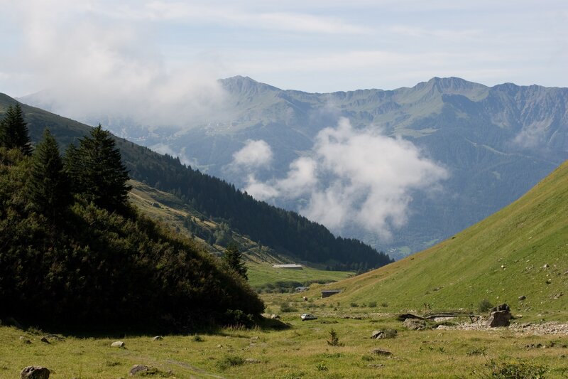 Mountain valley with clouds