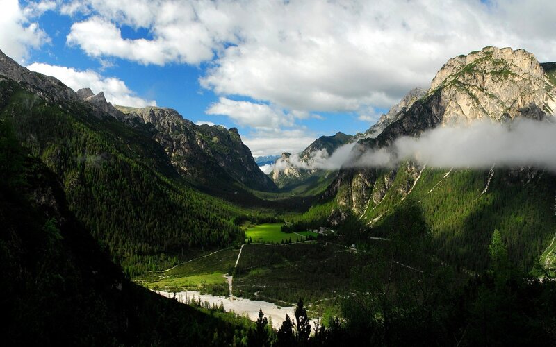 Mountain valley with clouds