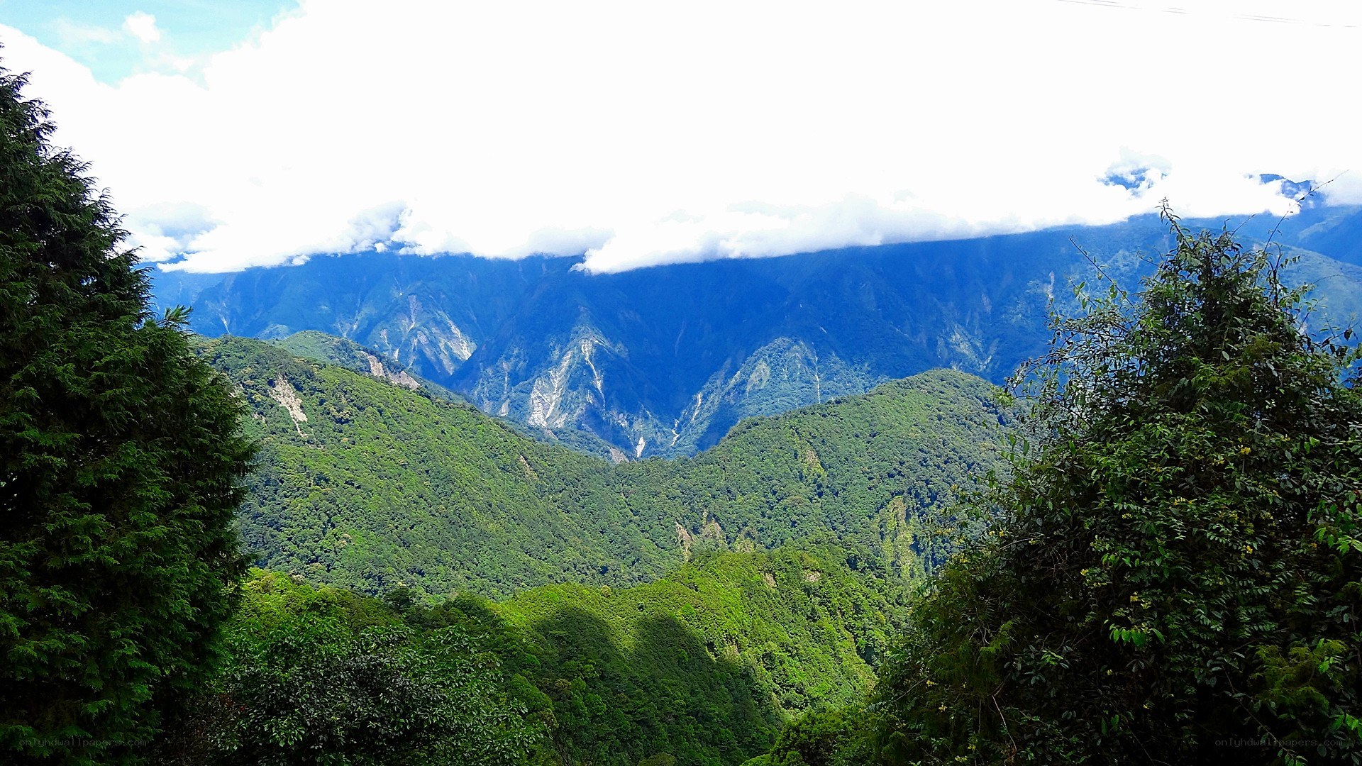 Mountain valley with clouds