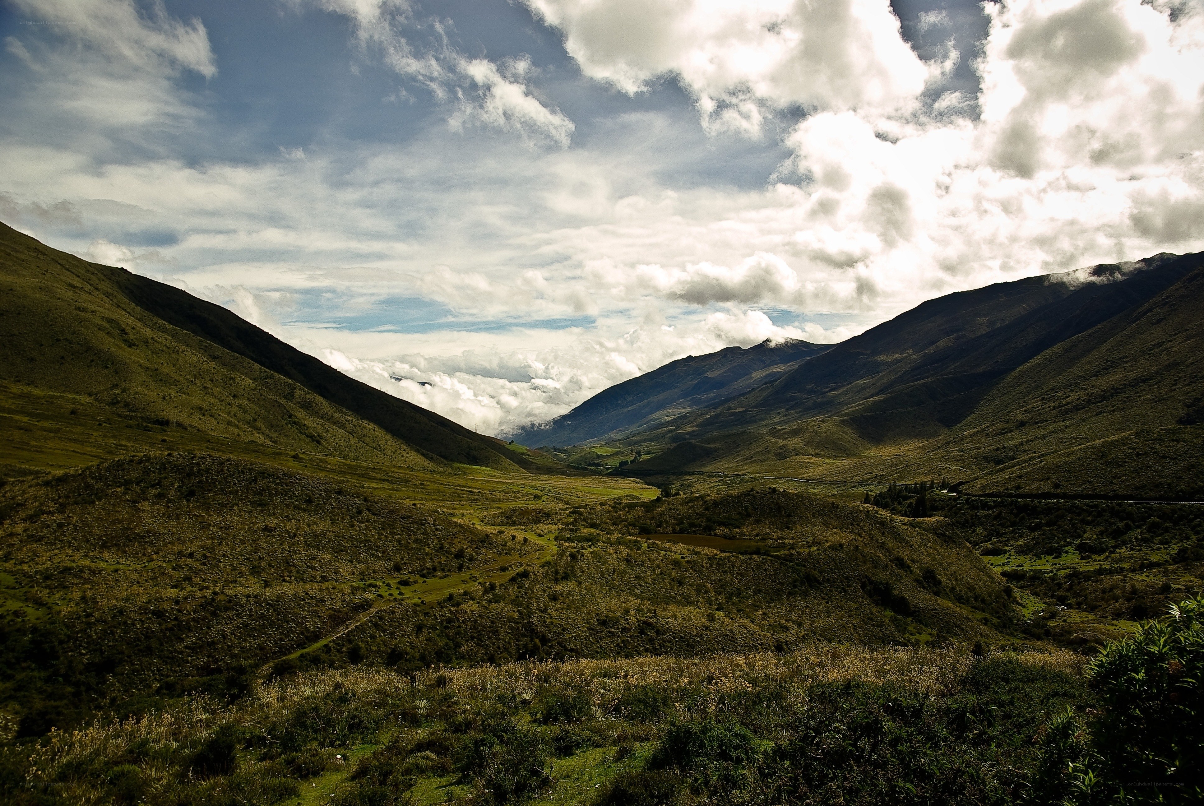Mountain valley with clouds