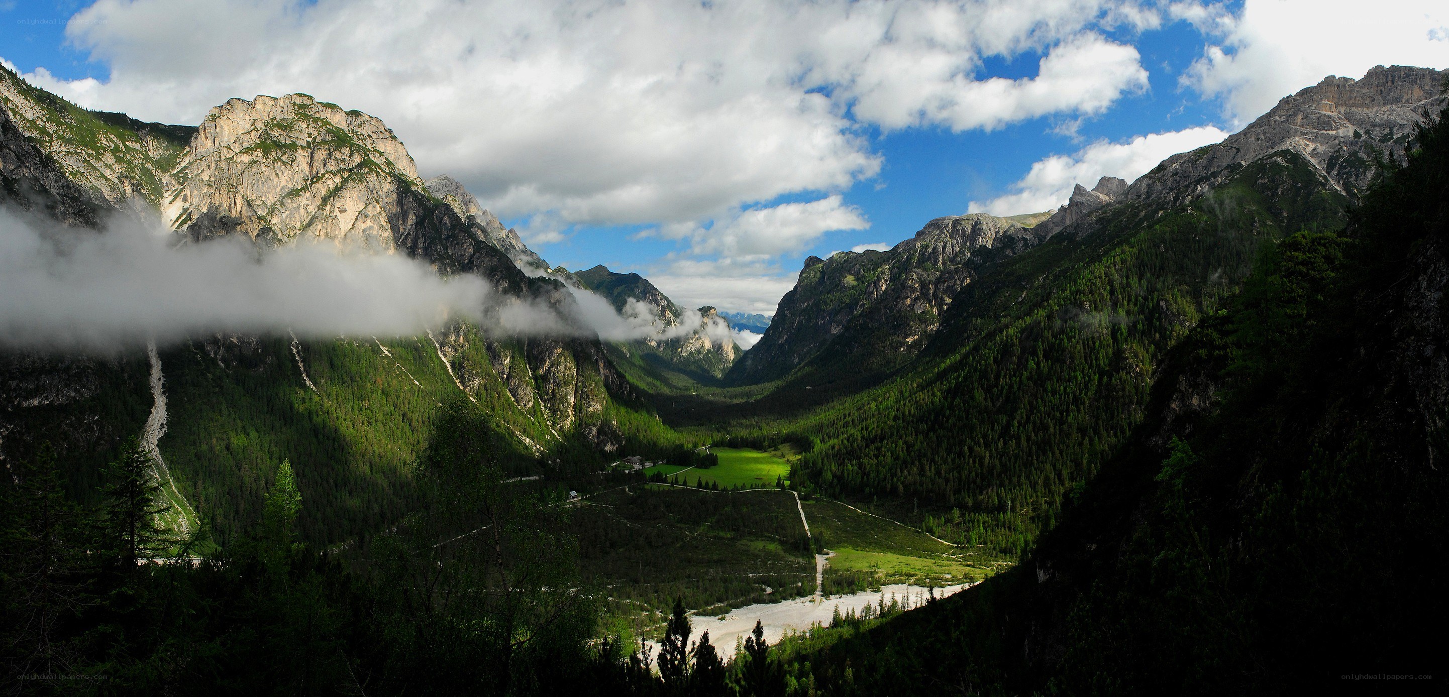 Mountain valley with clouds