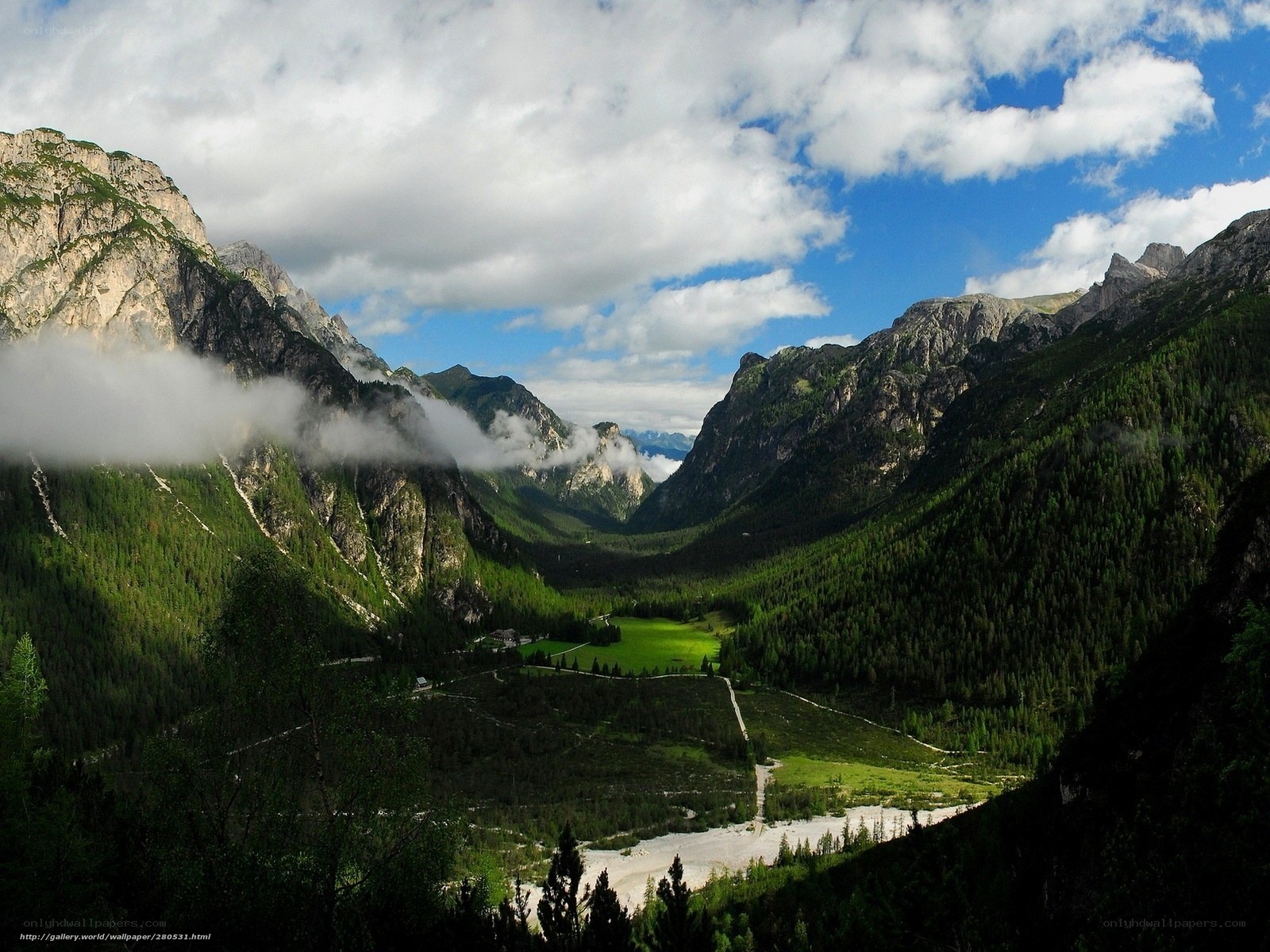 Mountain valley with clouds