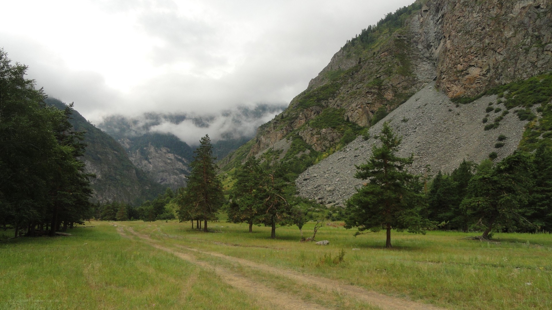 Mountain valley with dirt path