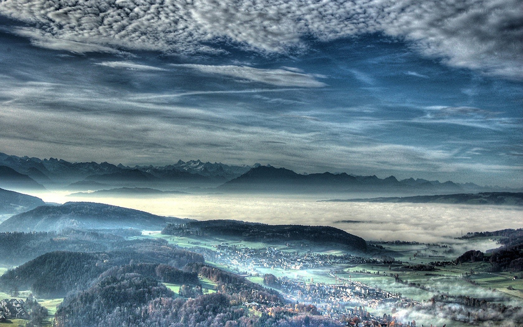 Mountain valley with fog and clouds