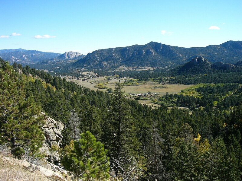 Mountain valley with forest and town