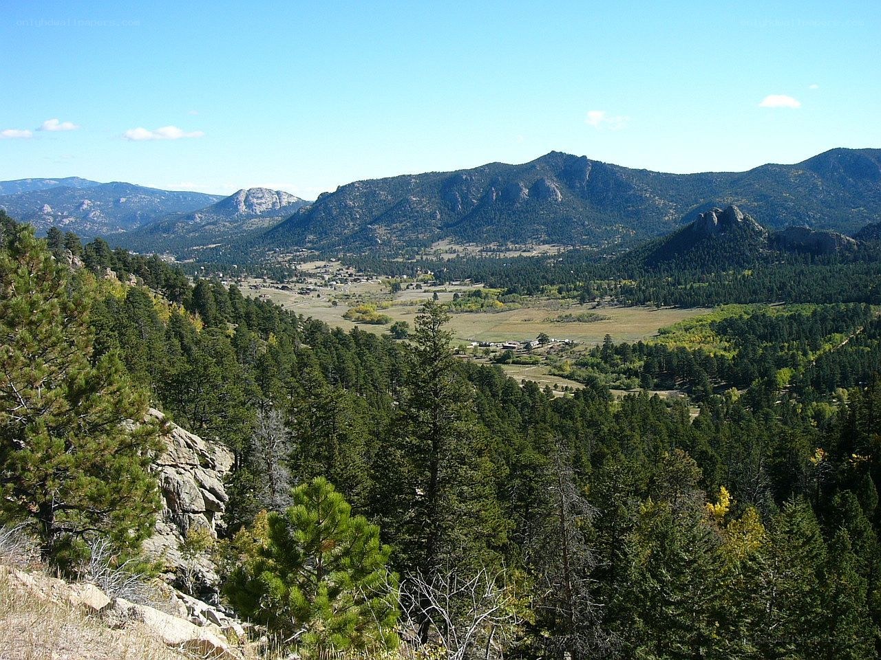 Mountain valley with forest and town