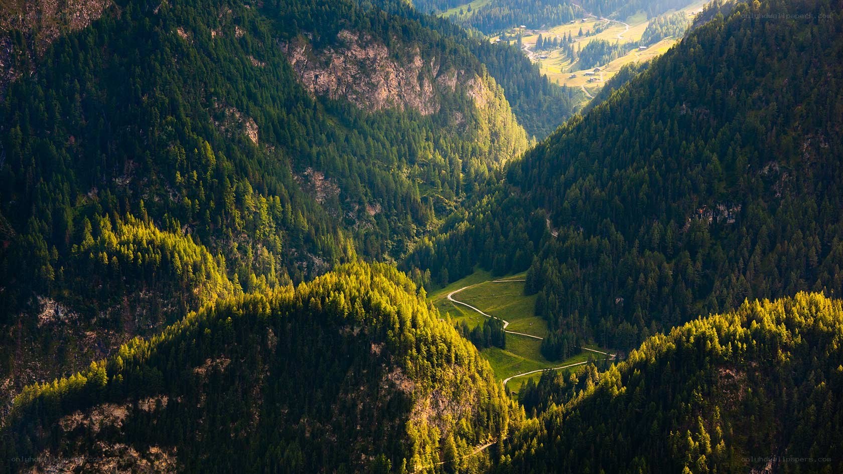 Mountain valley with forested slopes