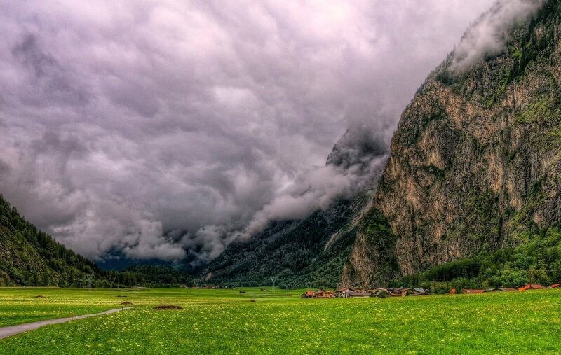 Mountain valley with green fields