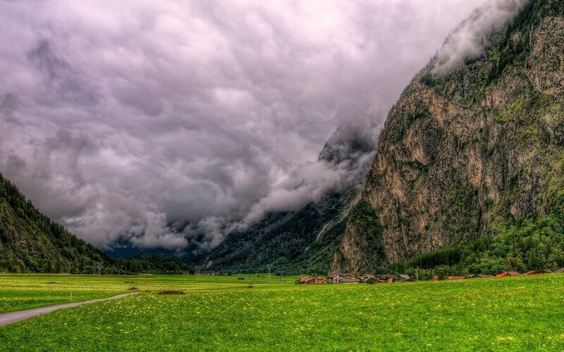 Mountain valley with green fields
