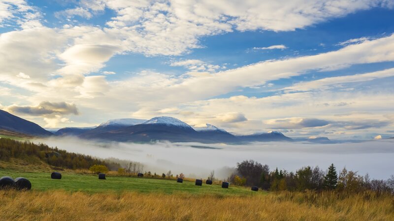 Mountain Valley with Hay Bales