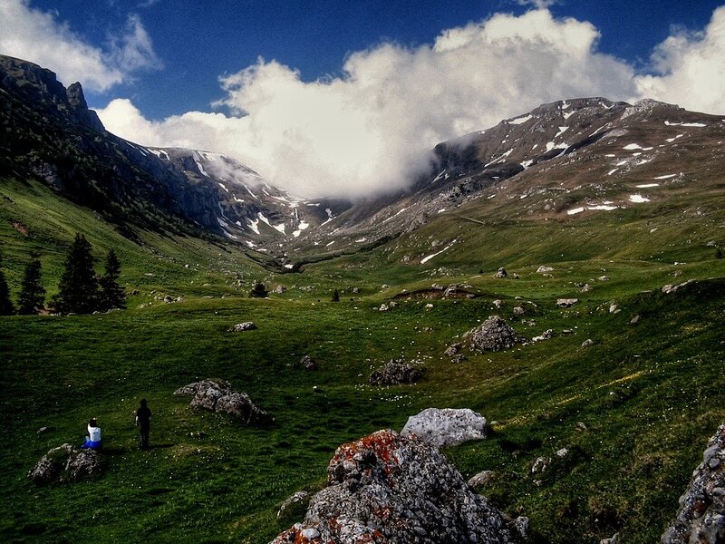 Mountain valley with hikers