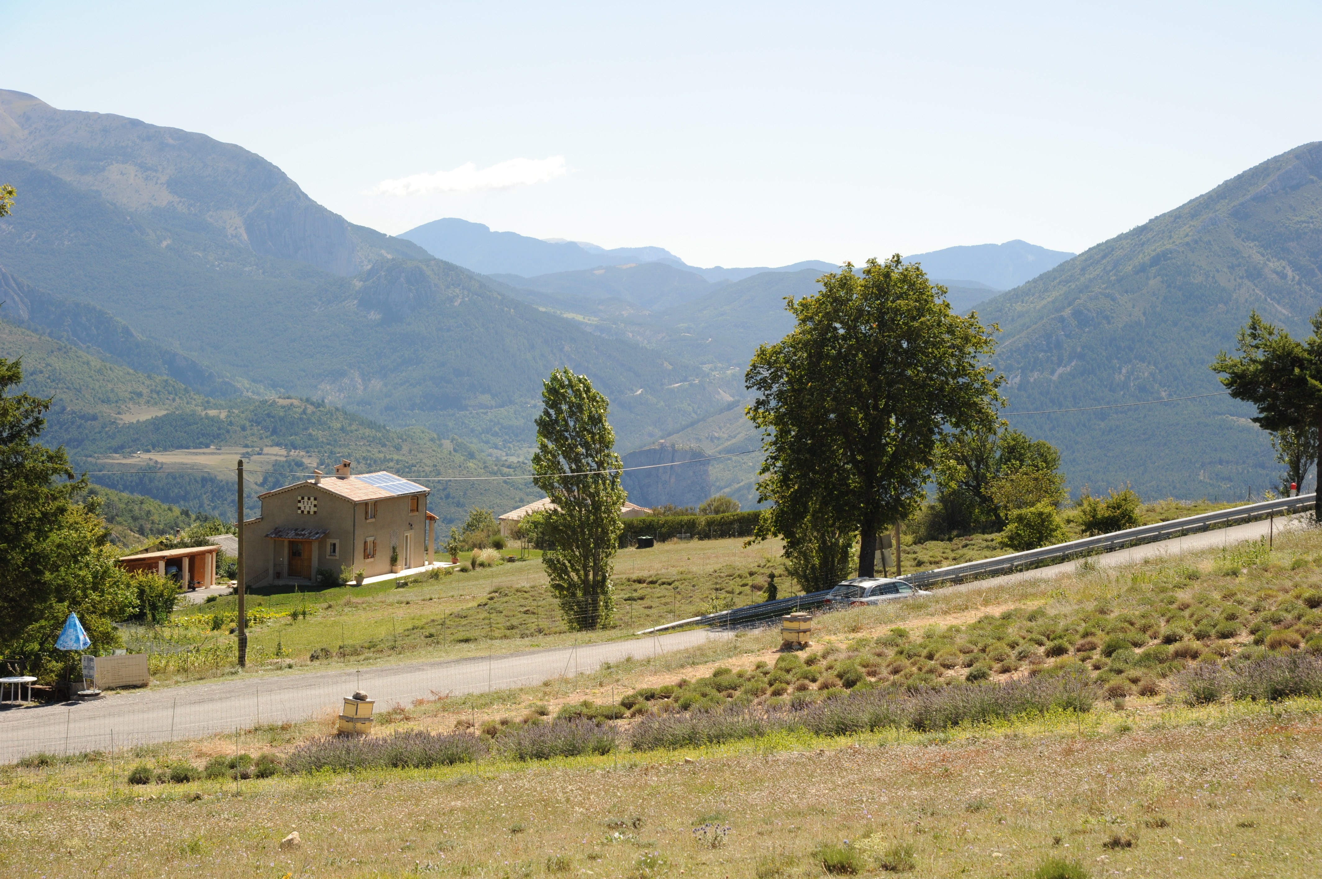 Mountain valley with house and road