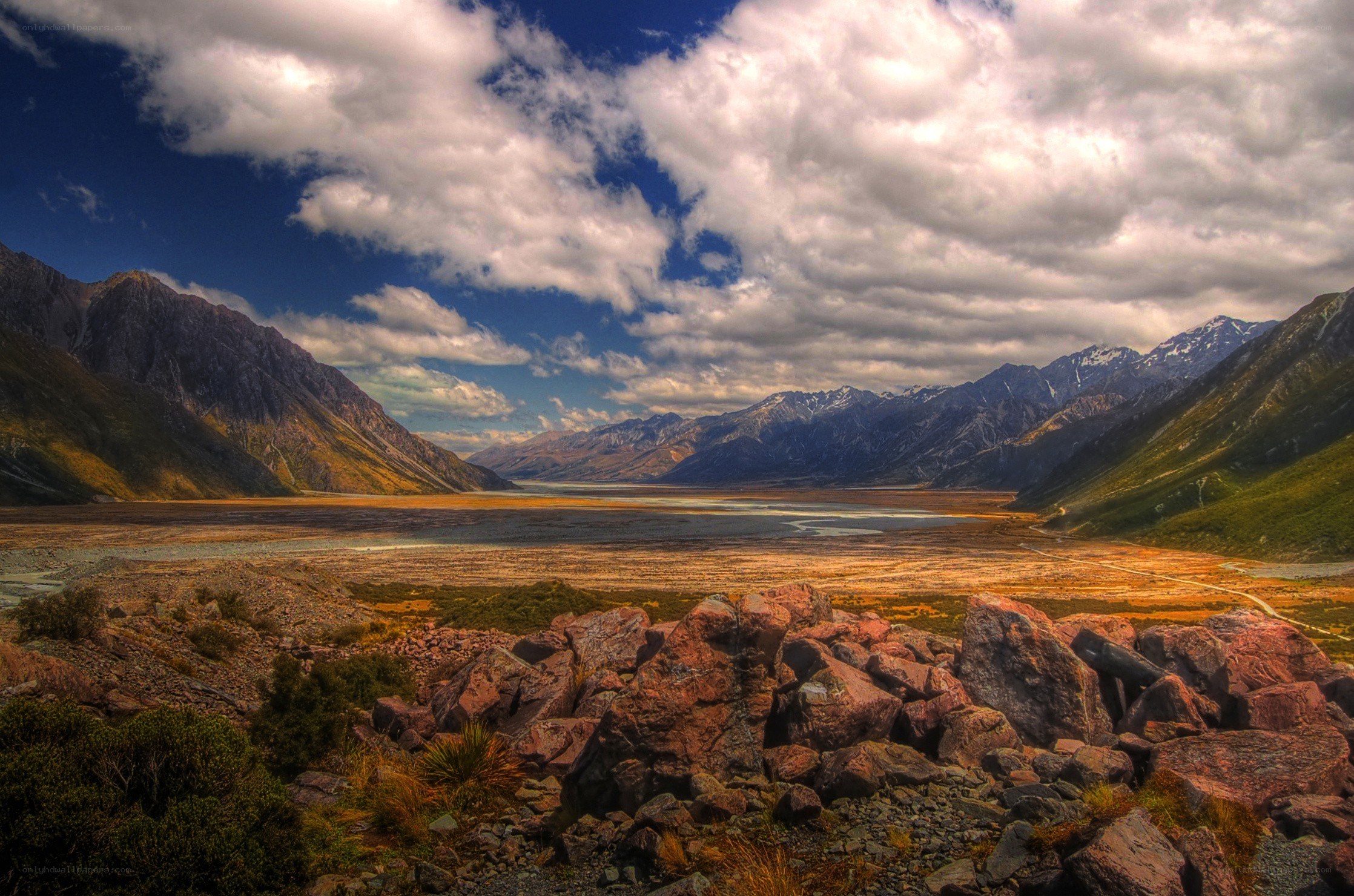 Mountain valley with lake and clouds