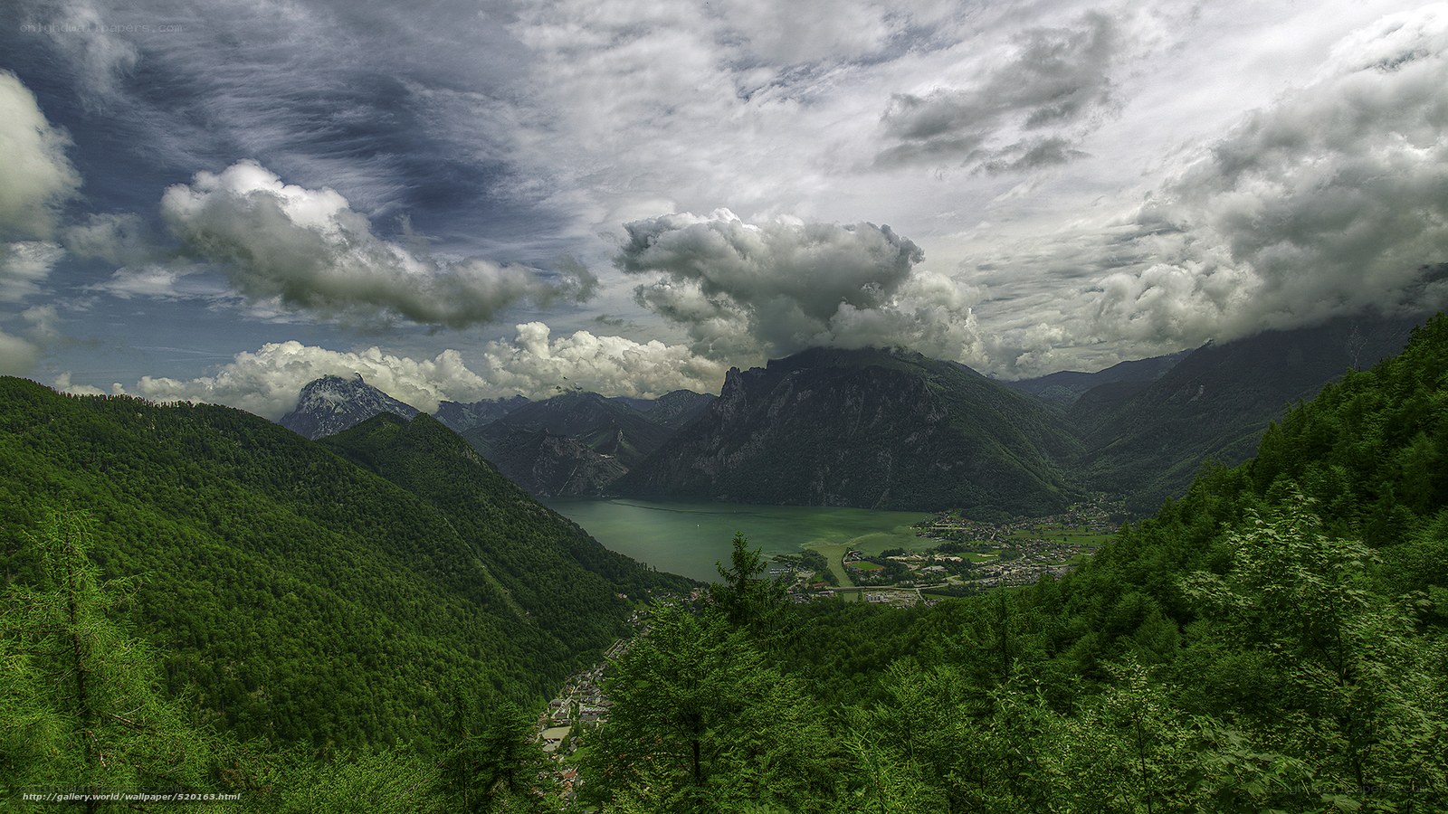 Mountain valley with lake and clouds
