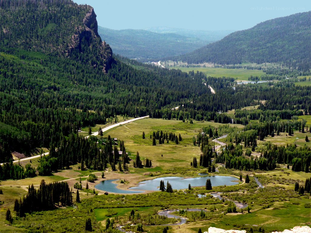 Mountain valley with lake and forest