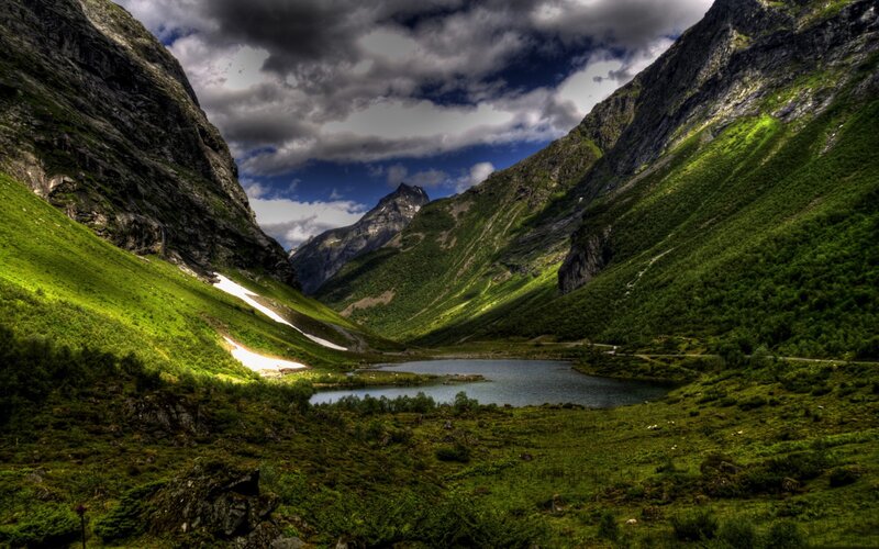 Mountain valley with lake and snow