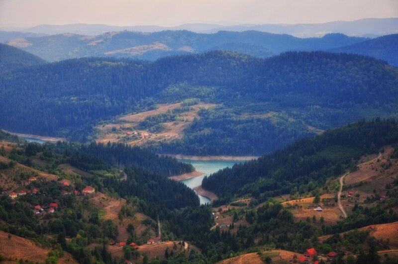 Mountain valley with lake and village