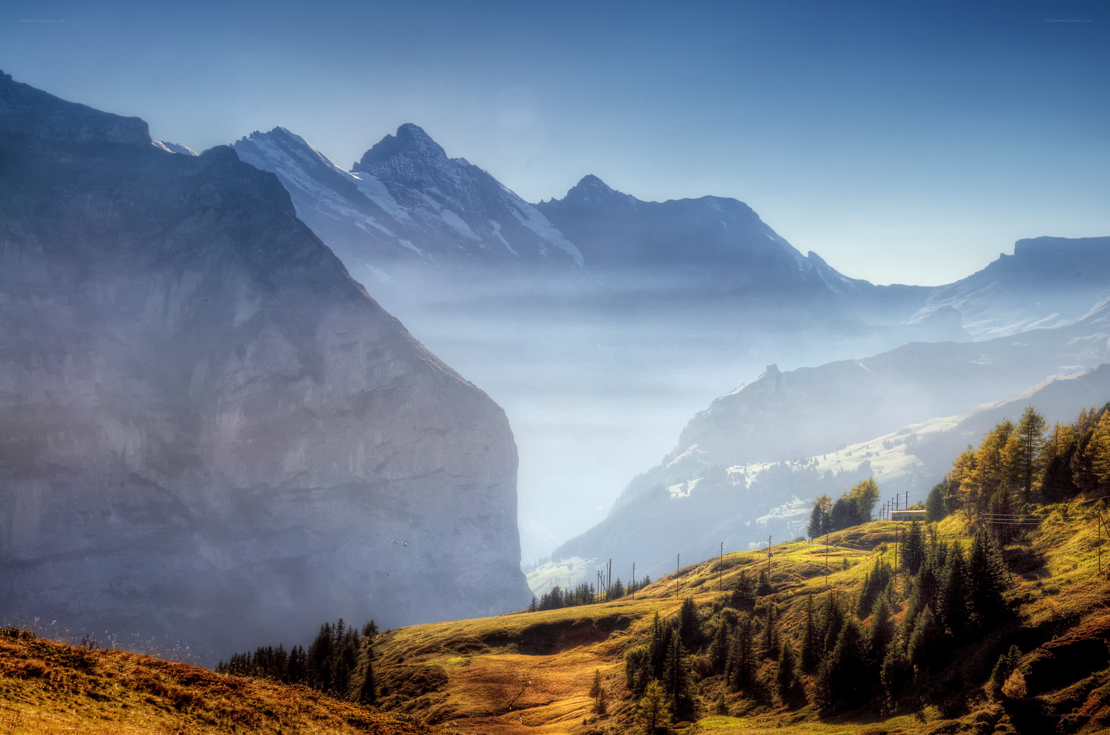 Mountain valley with misty peaks