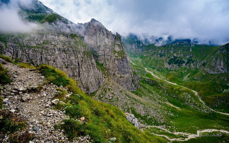 Mountain valley with misty peaks