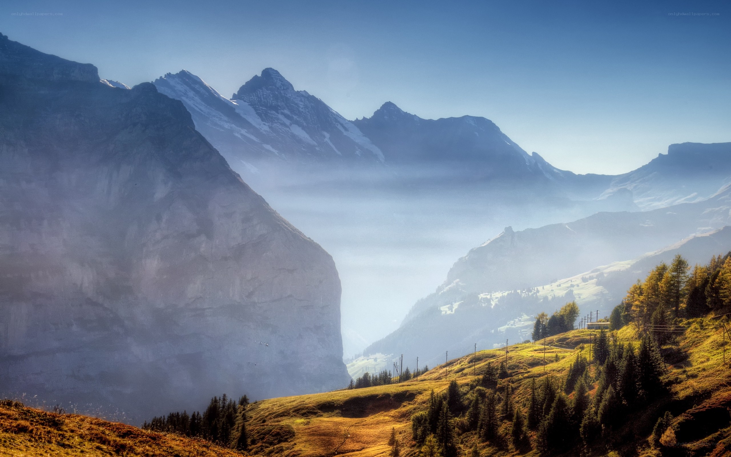 Mountain valley with misty peaks