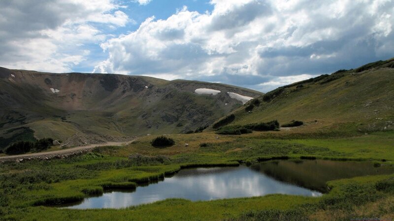 mountain valley with pond
